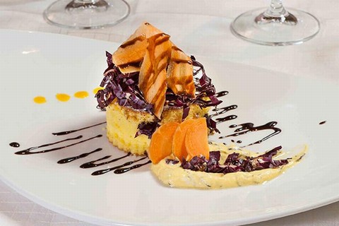 Radicchio di Chioggia cake on a carrot cream